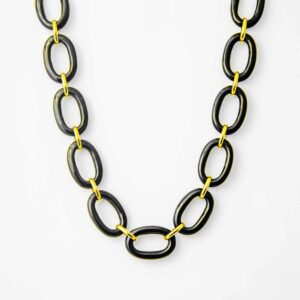 14 karat yellow gold and black onyx oval 18" toggle necklace. This necklace features 14 polished oval links approximately 16x11mm each and is attached by 14 karat yellow gold links and toggle style clasp.